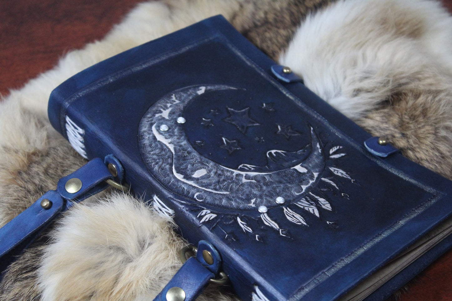 Blue Leather Bound Book with Moon, Stars, and Feather Motif